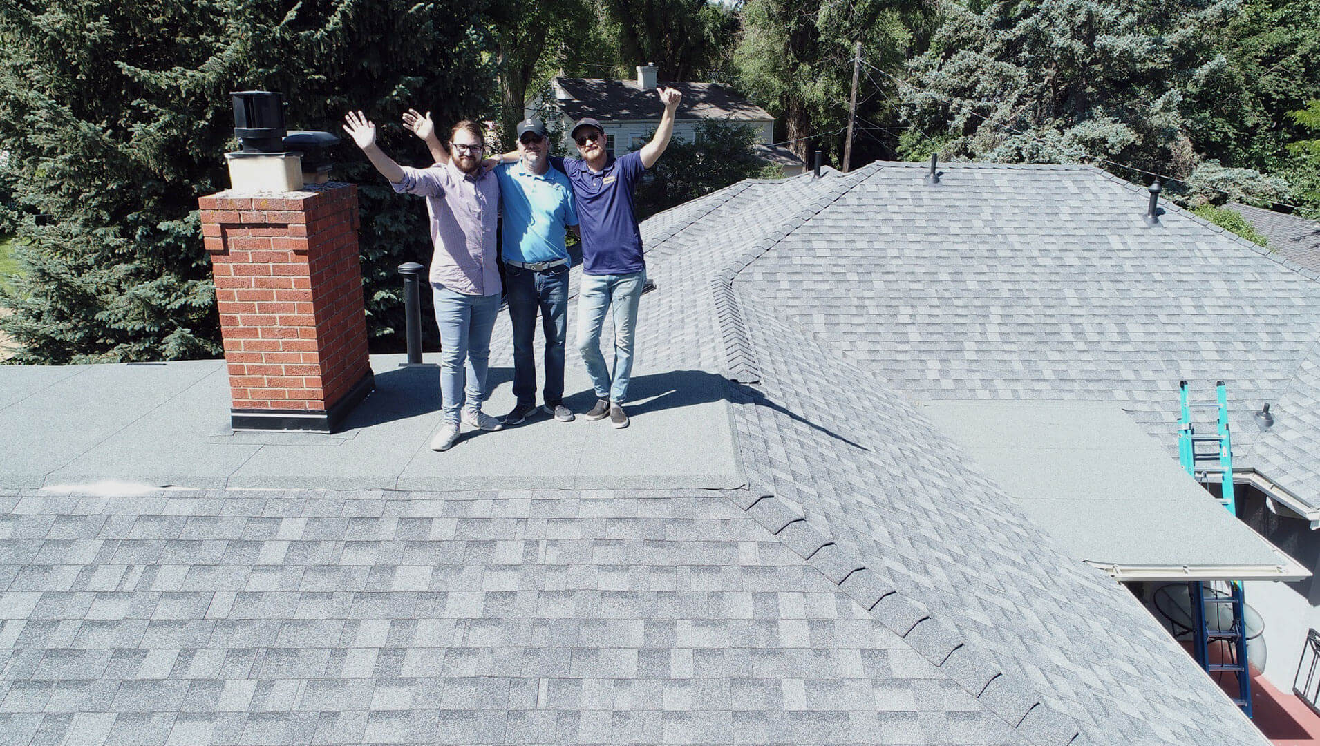 summit roofing solutions LLC roof with team members on top - Expert Roofing Services