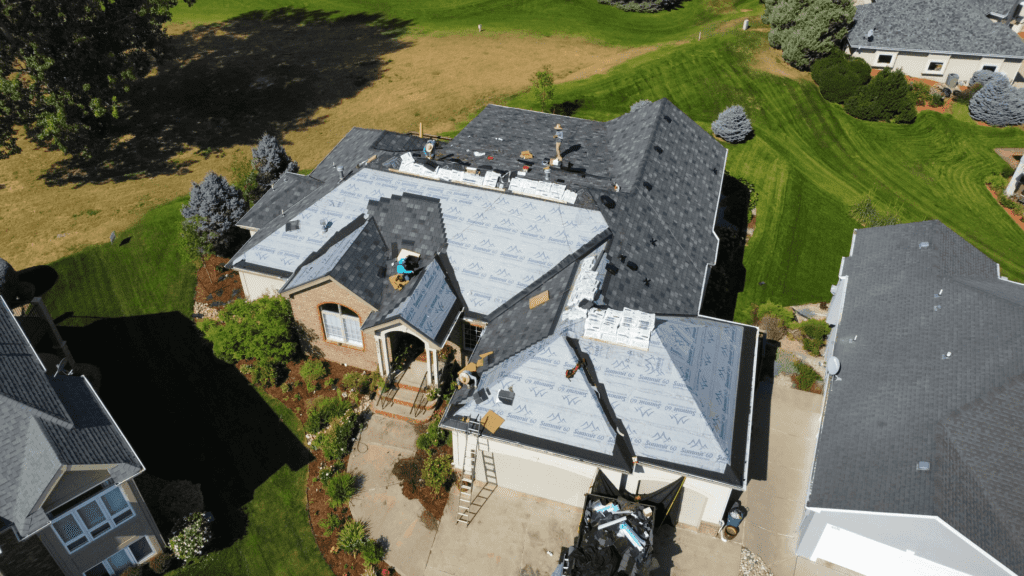 Roofing Companies Fort Collins - large home roof project from aerial view
