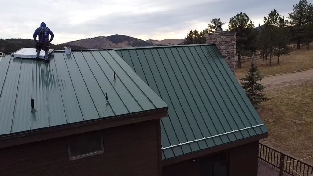 Summit Roofing Solutions team installing standing seam metal roof with total project control in Greeley CO