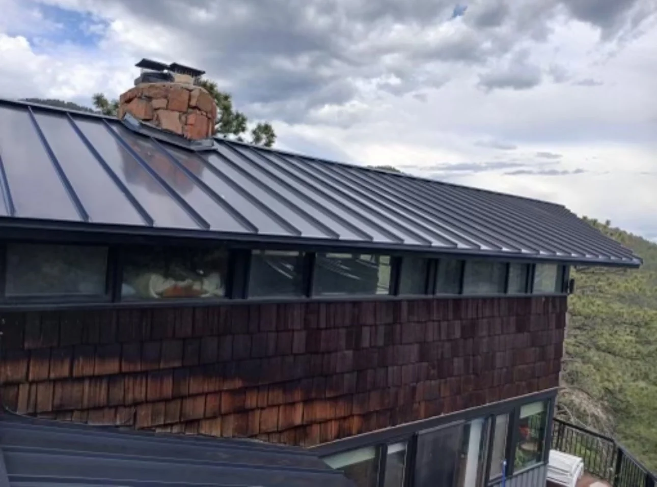 Standing seam metal roofing installation showing total project control by Summit Roofing Solutions in Northern Colorado